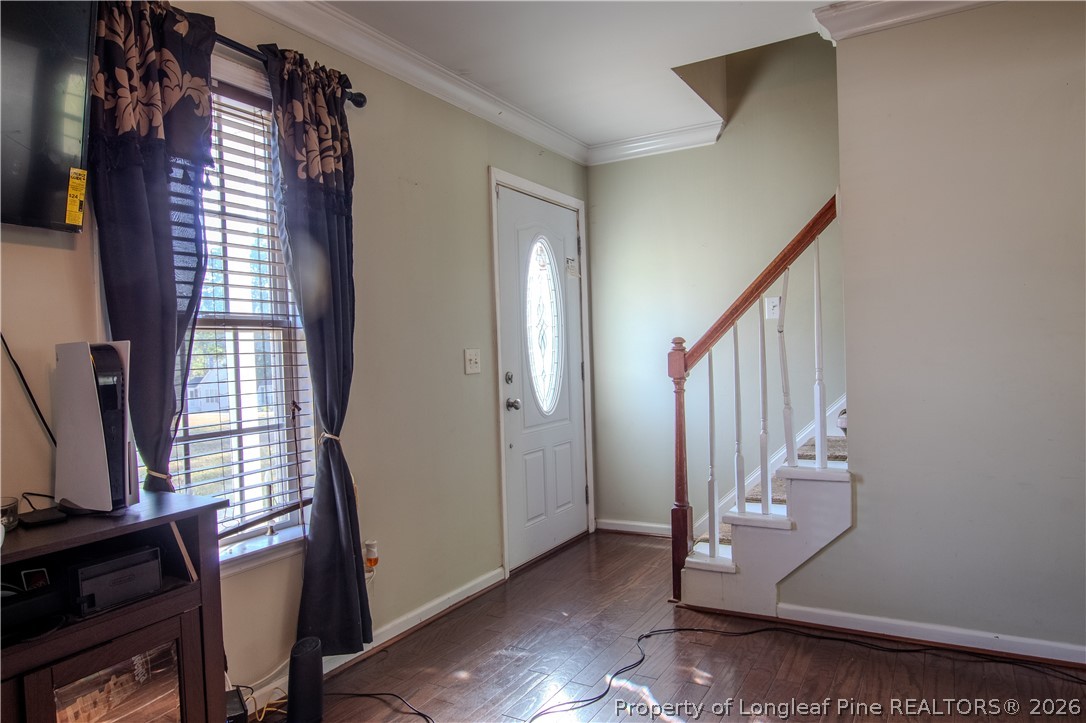 1629 Mattie Road Sanford, NC 27332 - Photo 5 of 29 a view of staircase with wooden floor and a window