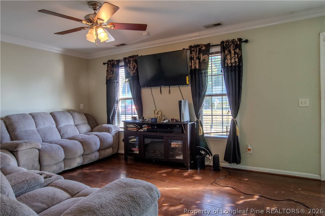 1629 Mattie Road Sanford, NC 27332 - Photo 6 of 29 a living room with furniture ceiling fan and a window
