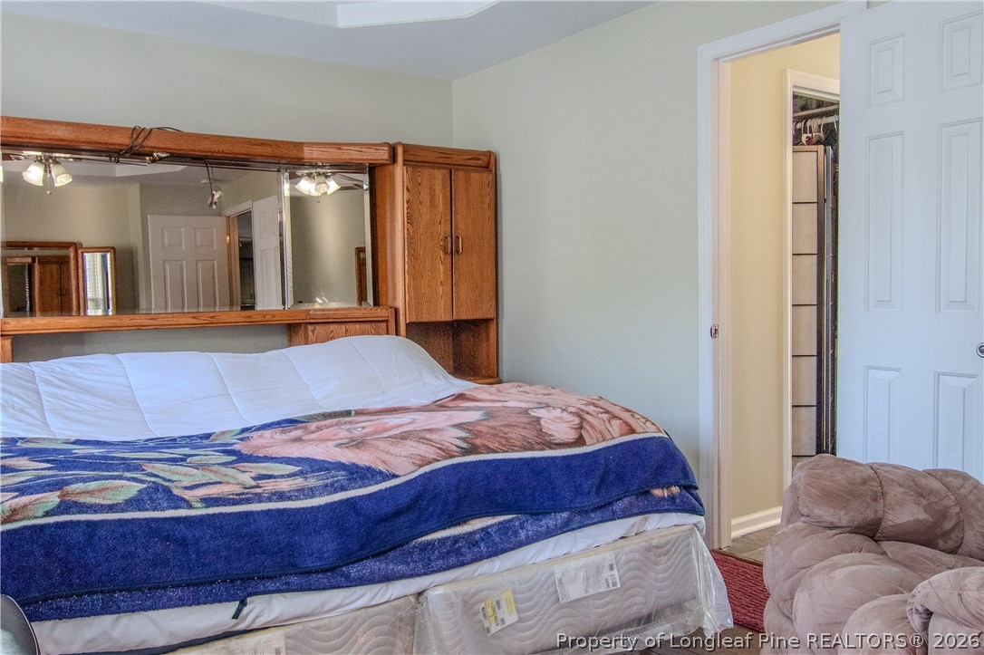 1629 Mattie Road Sanford, NC 27332 - Photo 10 of 29 a bedroom with a bed and window