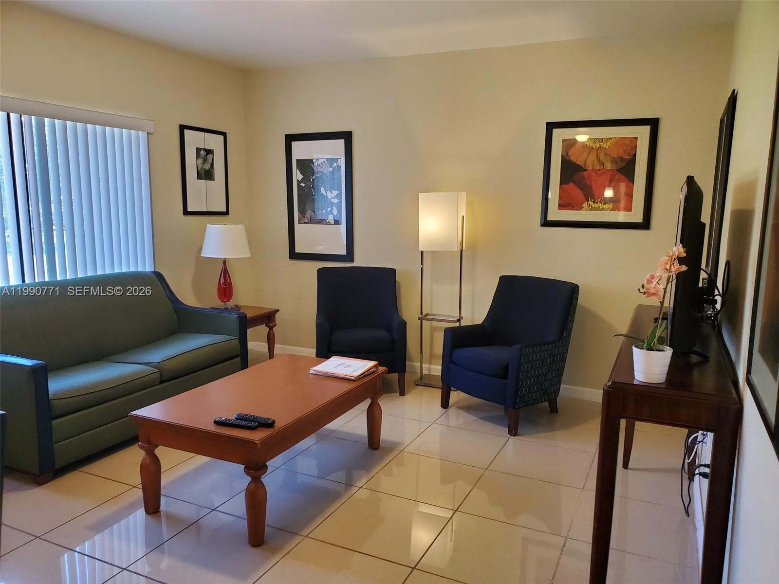 2015 Funston Street, Unit 2 Hollywood, FL 33020 - Photo 11 of 19 a living room with furniture and a rug