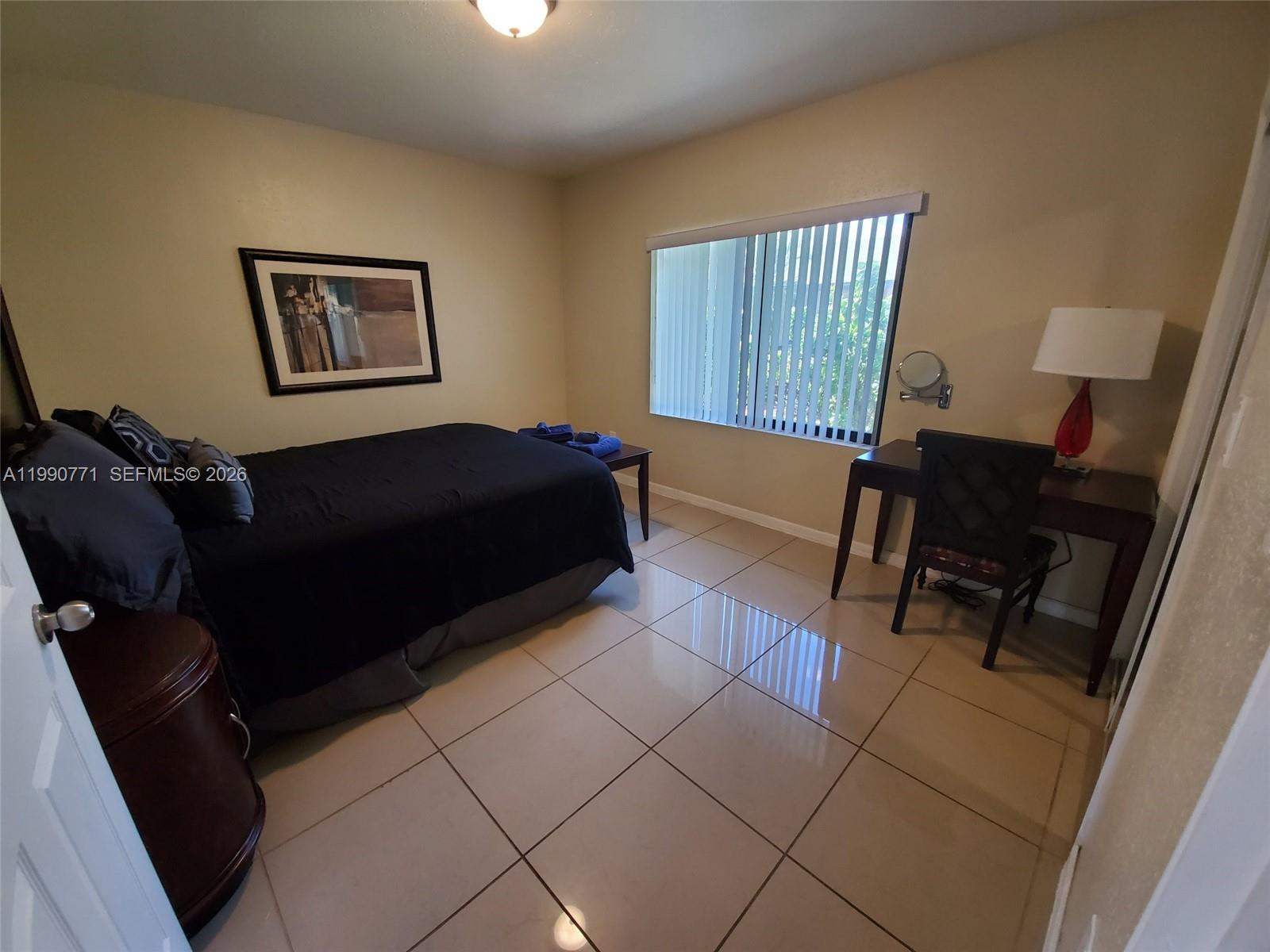 2015 Funston Street, Unit 2 Hollywood, FL 33020 - Photo 5 of 19 a living room with furniture and a window