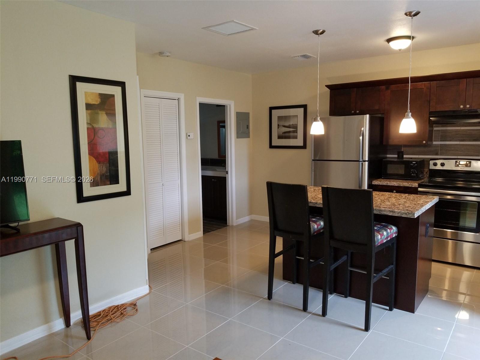 2015 Funston Street, Unit 2 Hollywood, FL 33020 - Photo 8 of 19 a view of a dining room with furniture