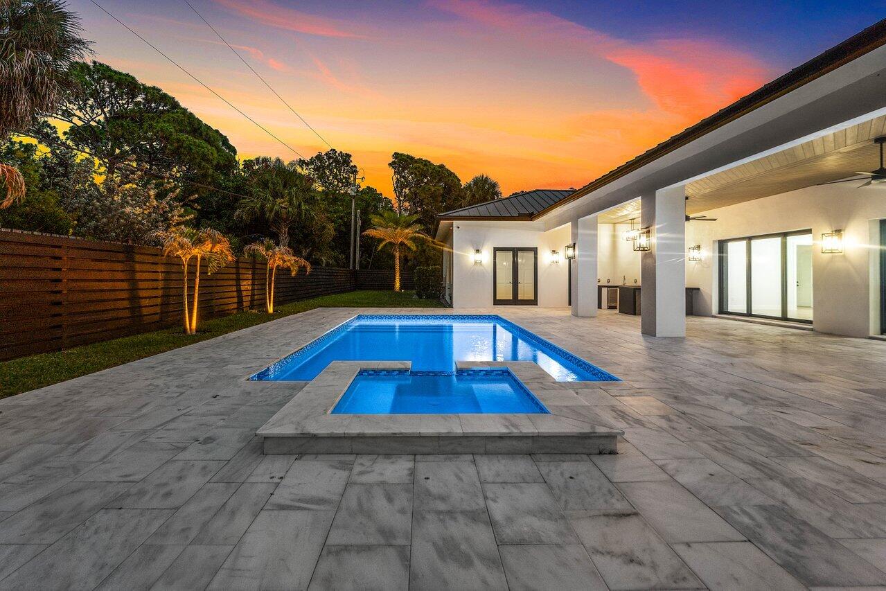 5701 Old Orange Road Jupiter, FL 33458 - Photo 18 of 46 a view of swimming pool with lounge chair