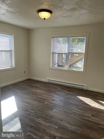 a bathroom with a toilet a sink and a bathtub