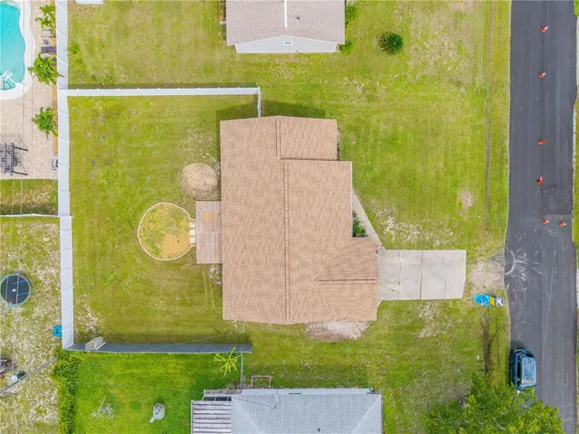swimming pool view with a garden