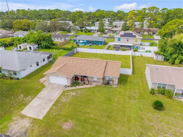 a view of yard with swimming pool and outdoor seating