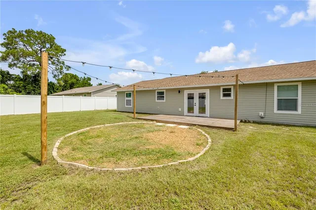 a view of pool with a backyard