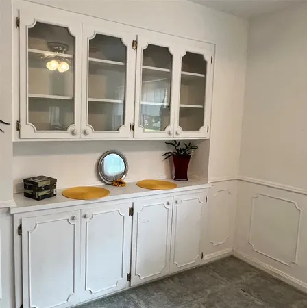 a view of cabinets and window