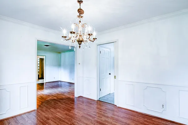 a room with a cabinet and wooden floor