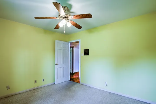 a bathroom with a granite countertop sink and a large mirror