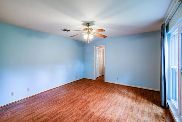 a bathroom with a shower curtain and a sink