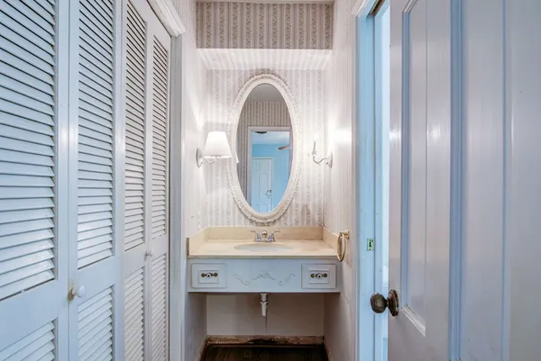 a bathroom with a sink and mirror