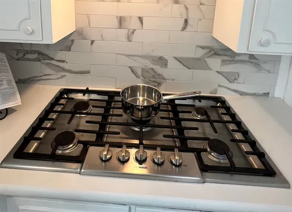 a close view of a stove a microwave and a sink