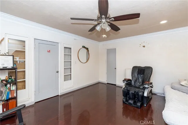 a bedroom with two beds and a large window