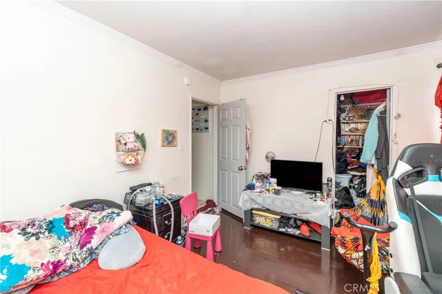 a bedroom with a bed and cabinets