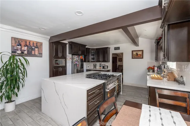 a kitchen that has a lot of cabinets in it