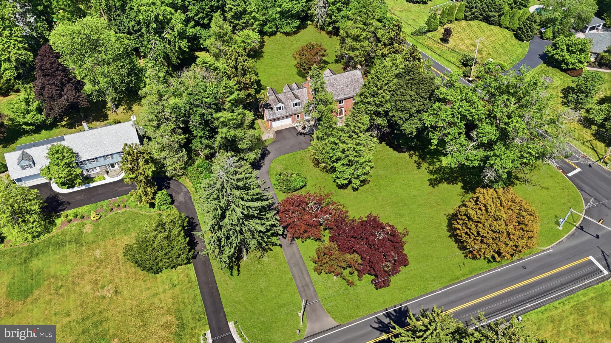 2007 Makefield Road Yardley, PA 19067 - Photo 3 of 3 Lush estate surrounded by vibrant greenery.