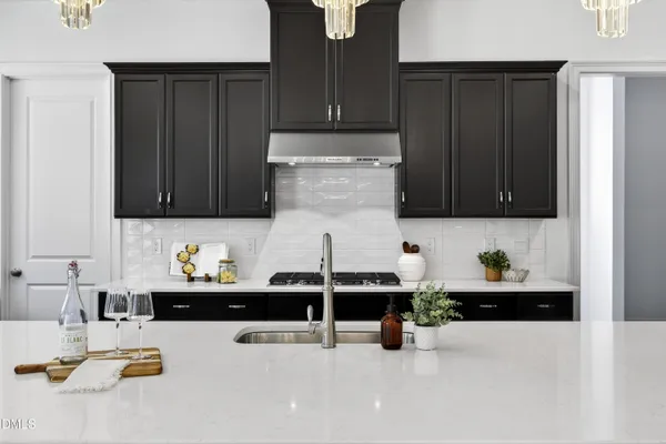 a kitchen with a refrigerator and a cabinets