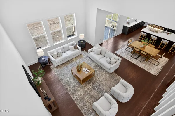 a spacious bedroom with a bed and a couch