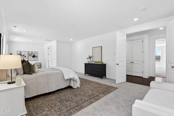 a living room with a couch and a dresser
