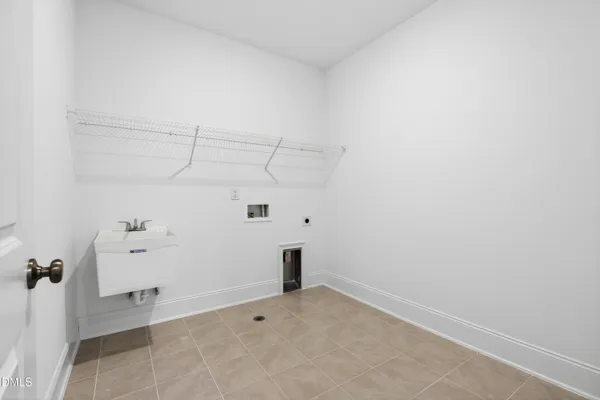 a view of a hallway with wooden floor and entryway