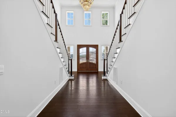 a view of an entryway with wooden floor
