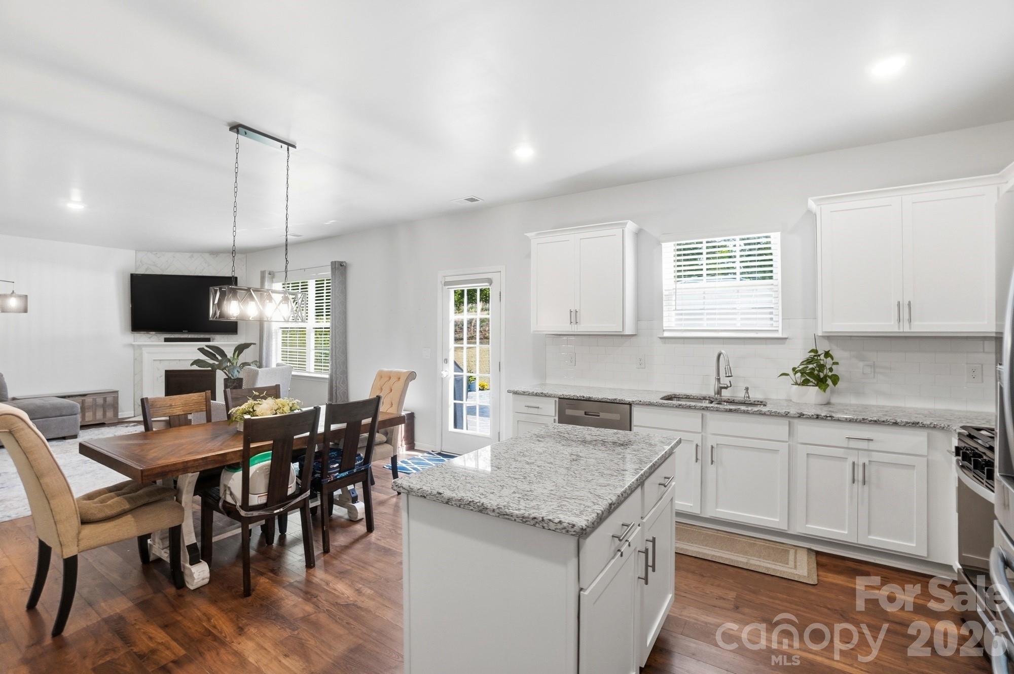 116 Timbergreen Court Troutman, NC 28166 - Photo 14 of 43 a kitchen that has a table and chairs in it