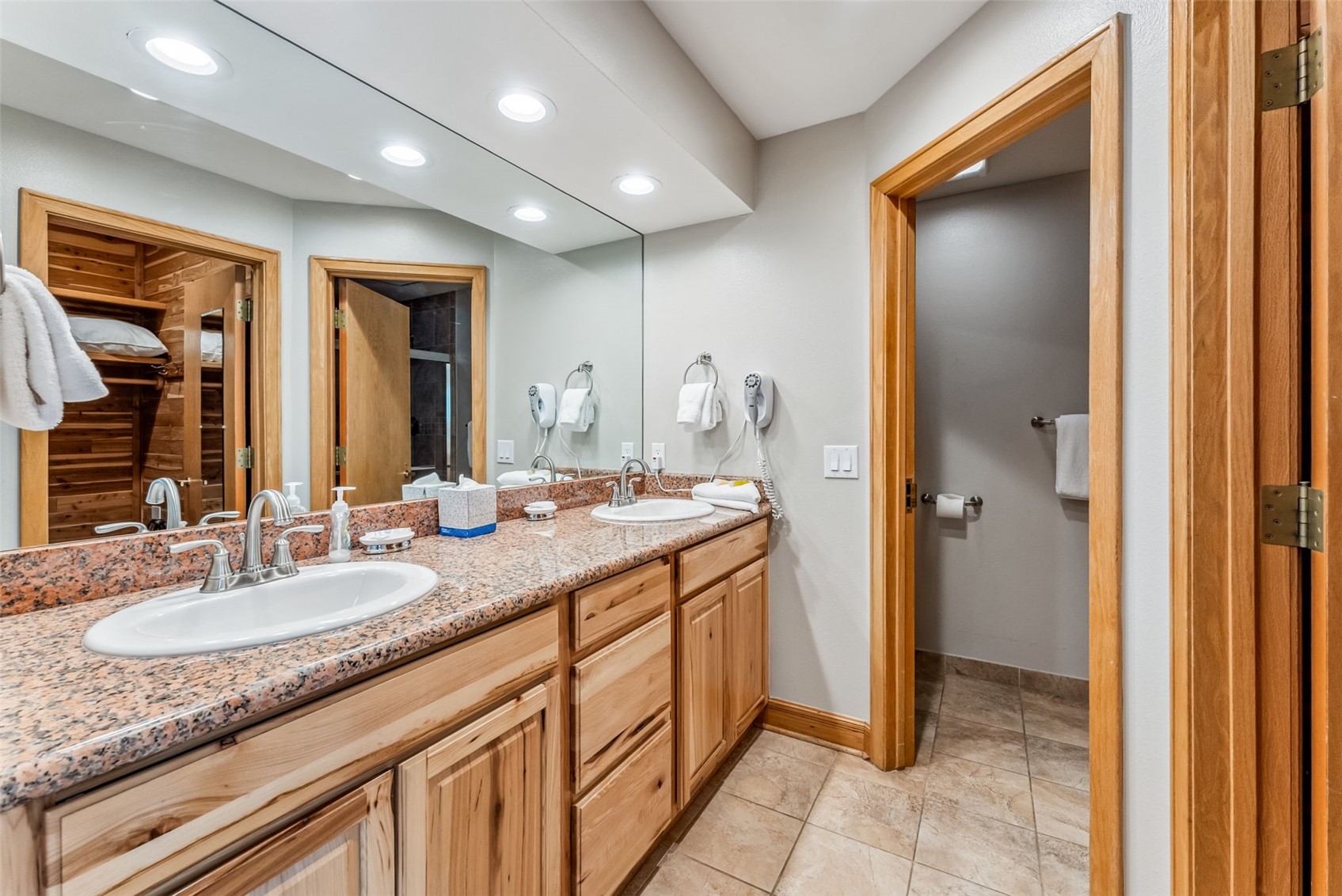1203 West Keystone Road, Unit 2711 Keystone, CO 80435 - Photo 31 of 36 Updated bathroom featuring double sink vanity and tile patterned flooring
