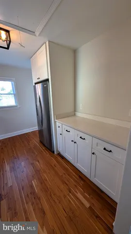 a view of cabinets with wooden floor