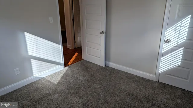 a view of a room with stairs and a window