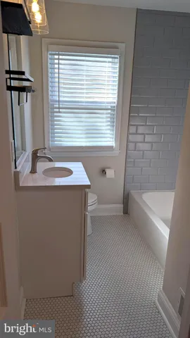 a bathroom with a sink and a bathtub