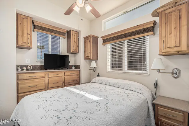 a kitchen with stainless steel appliances granite countertop a sink dishwasher a stove and white countertops with wooden floor