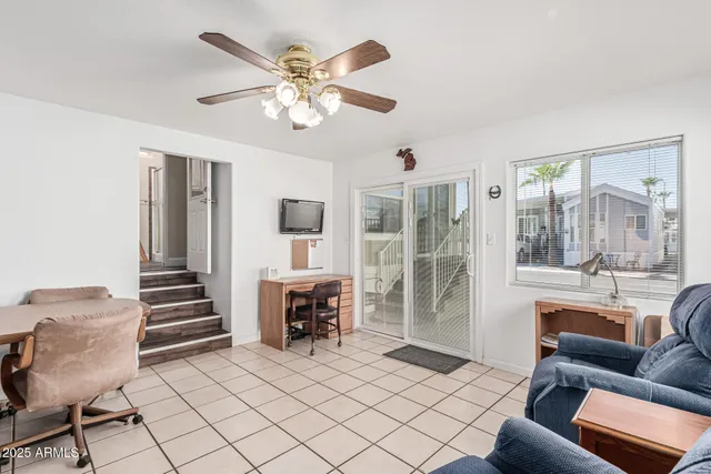 a view of a livingroom with furniture and a chandelier