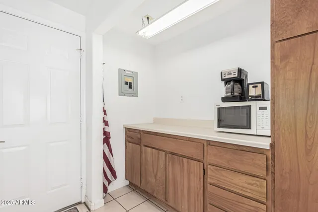 a bedroom with furniture and a large window
