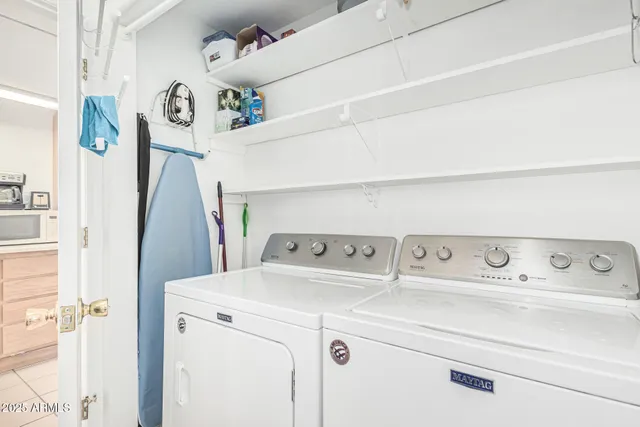 a kitchen with stainless steel appliances a refrigerator and cabinets