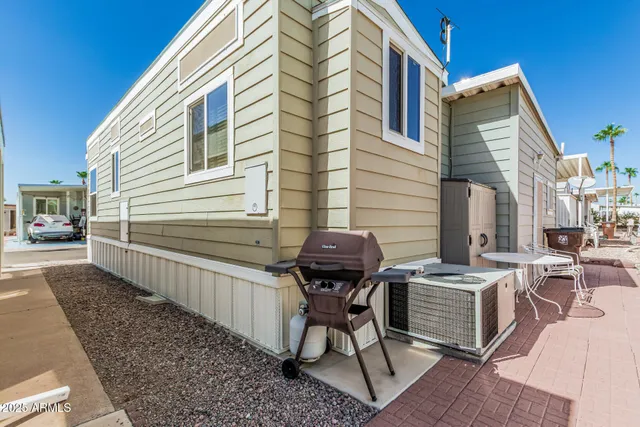 a white sink sitting under a bathroom mirror