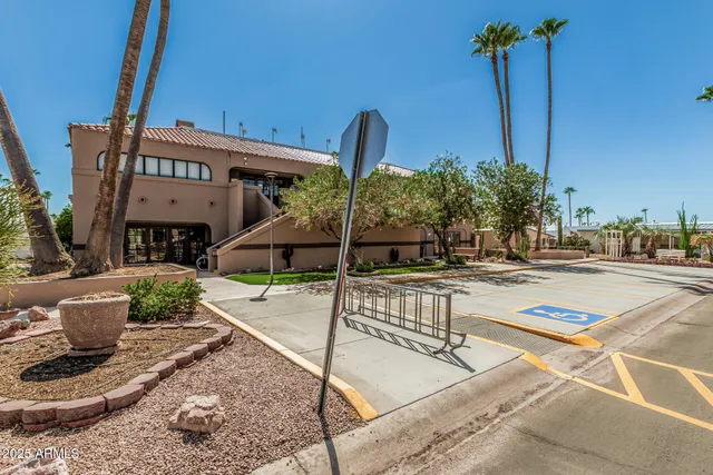 a front view of a building with garden