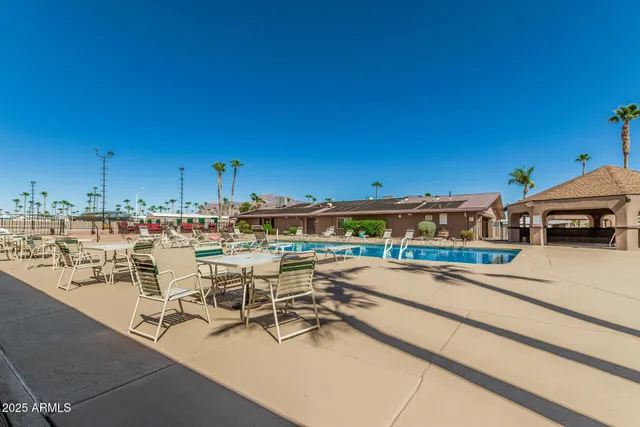 a view of a swimming pool with a yard