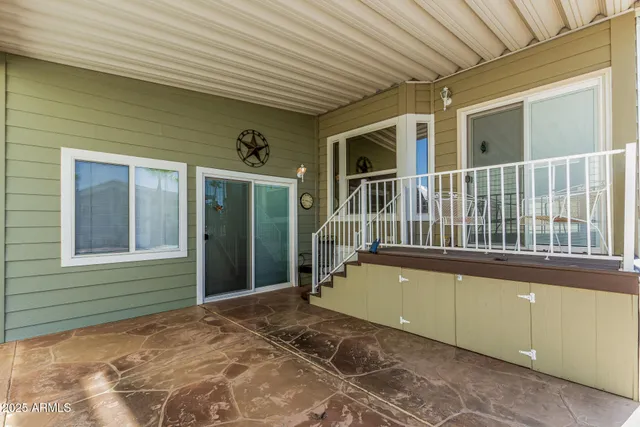 a view of a house with sitting area and view of a house