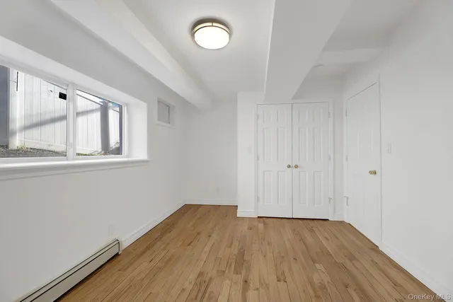 a bathroom with a sink mirror and toilet