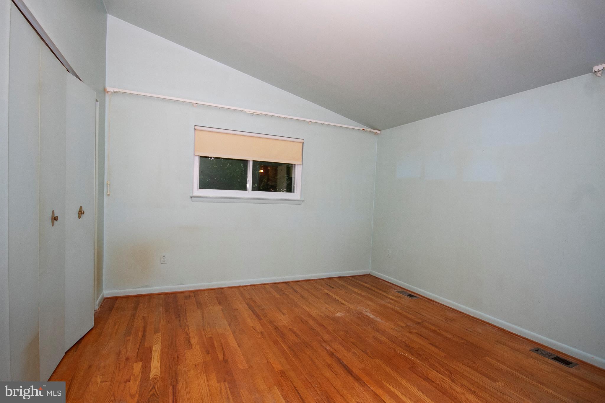 7402 Prince George Road Baltimore, MD 21208 - Photo 22 of 26 a view of empty room with wooden floor