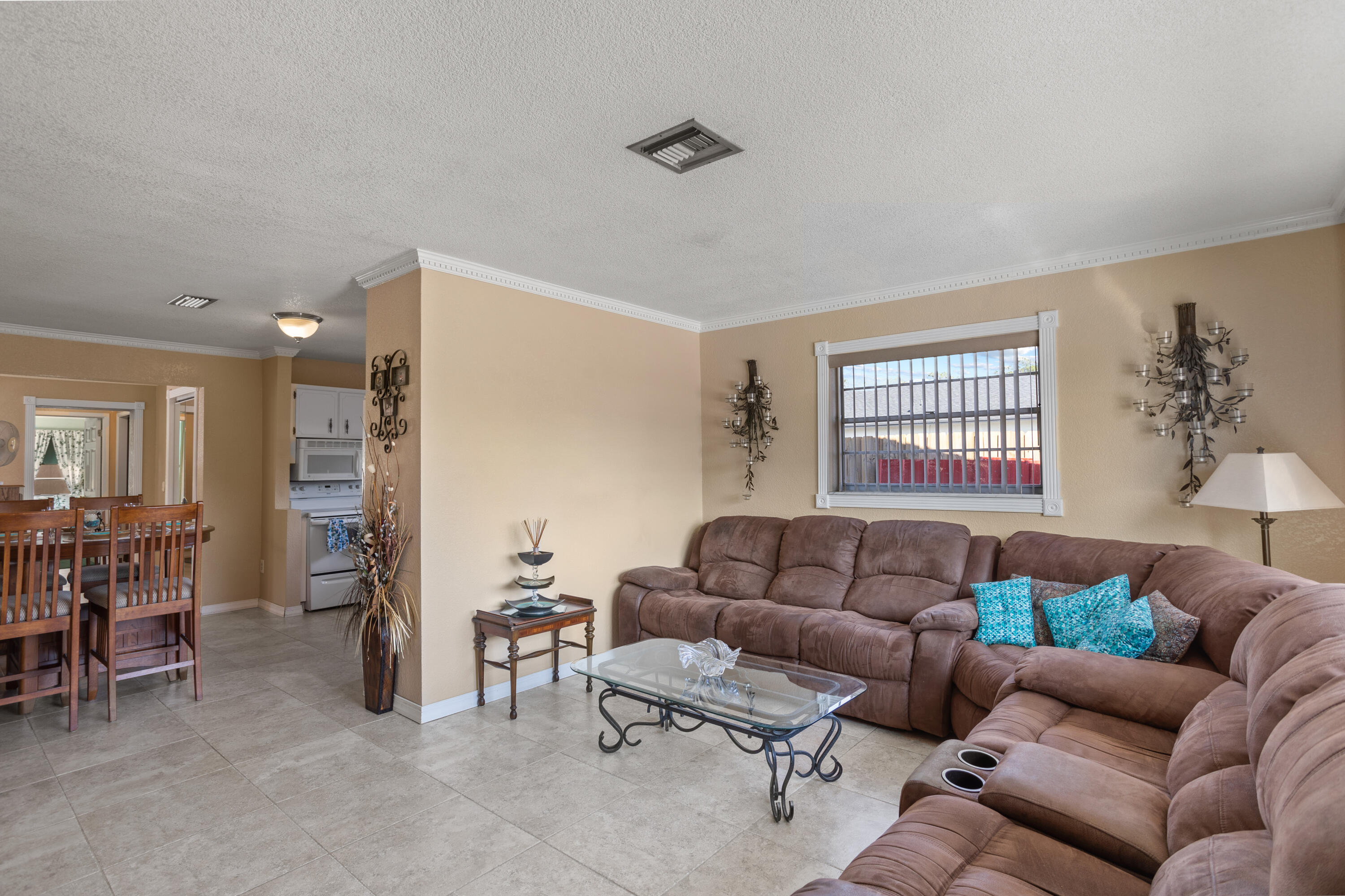 5655 Papaya Road West Palm Beach, FL 33413 - Photo 5 of 24 5 Living Room into Dining-Kitchen Area