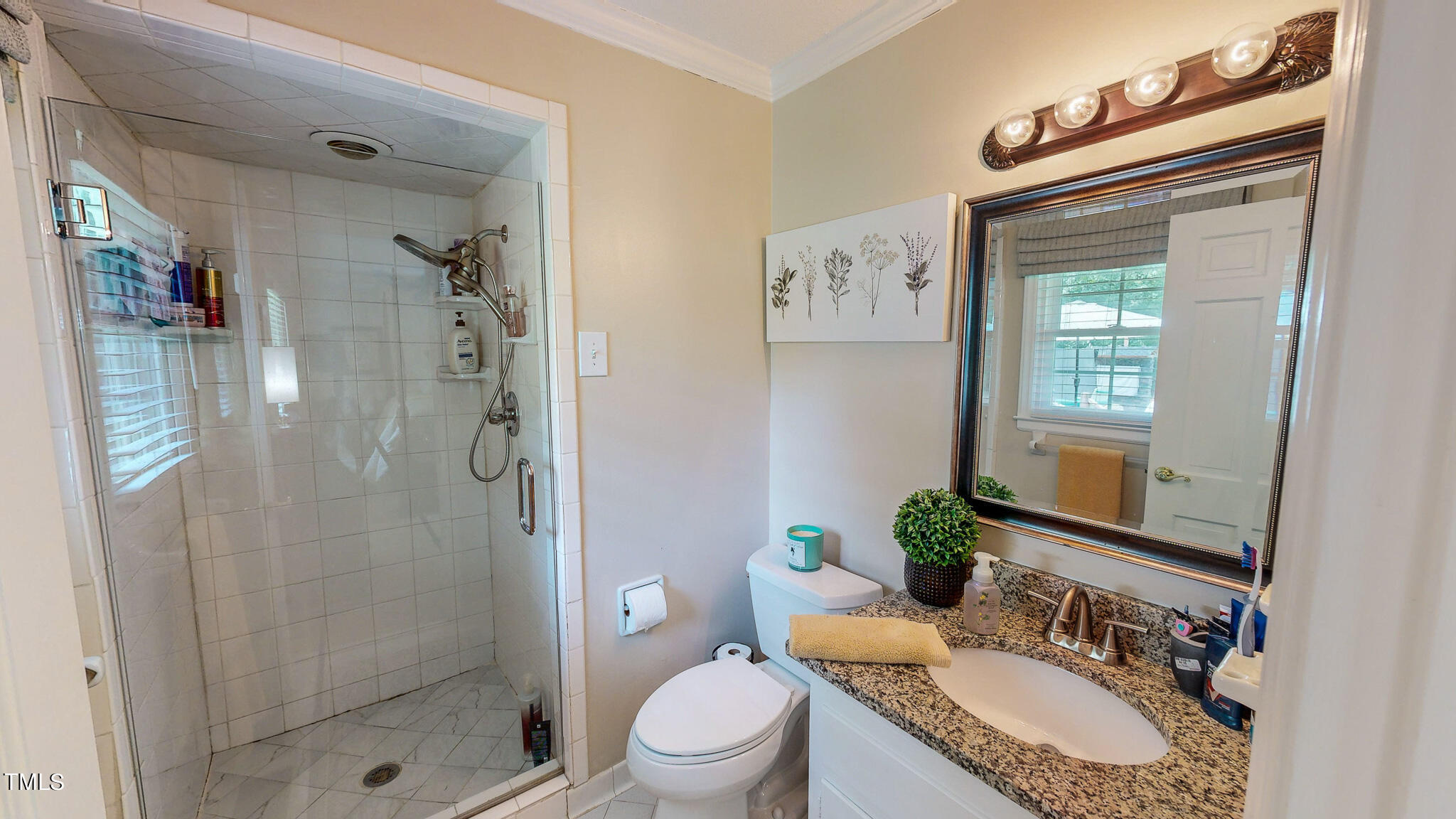 1804 Grady Drive Durham, NC 27712 - Photo 18 of 43 a bathroom with a granite countertop sink toilet and shower