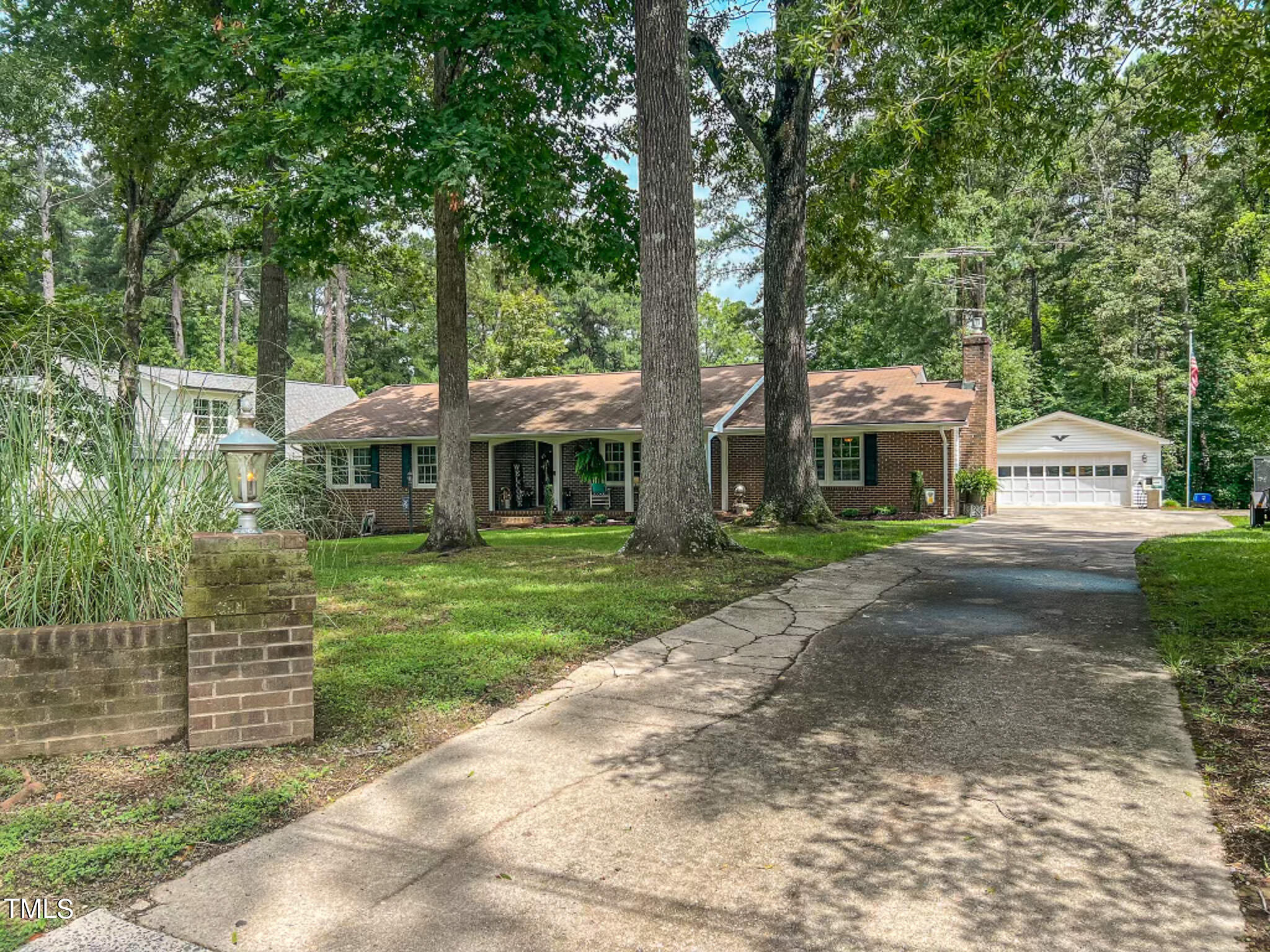 1804 Grady Drive Durham, NC 27712 - Photo 19 of 43 a front view of a house with a yard