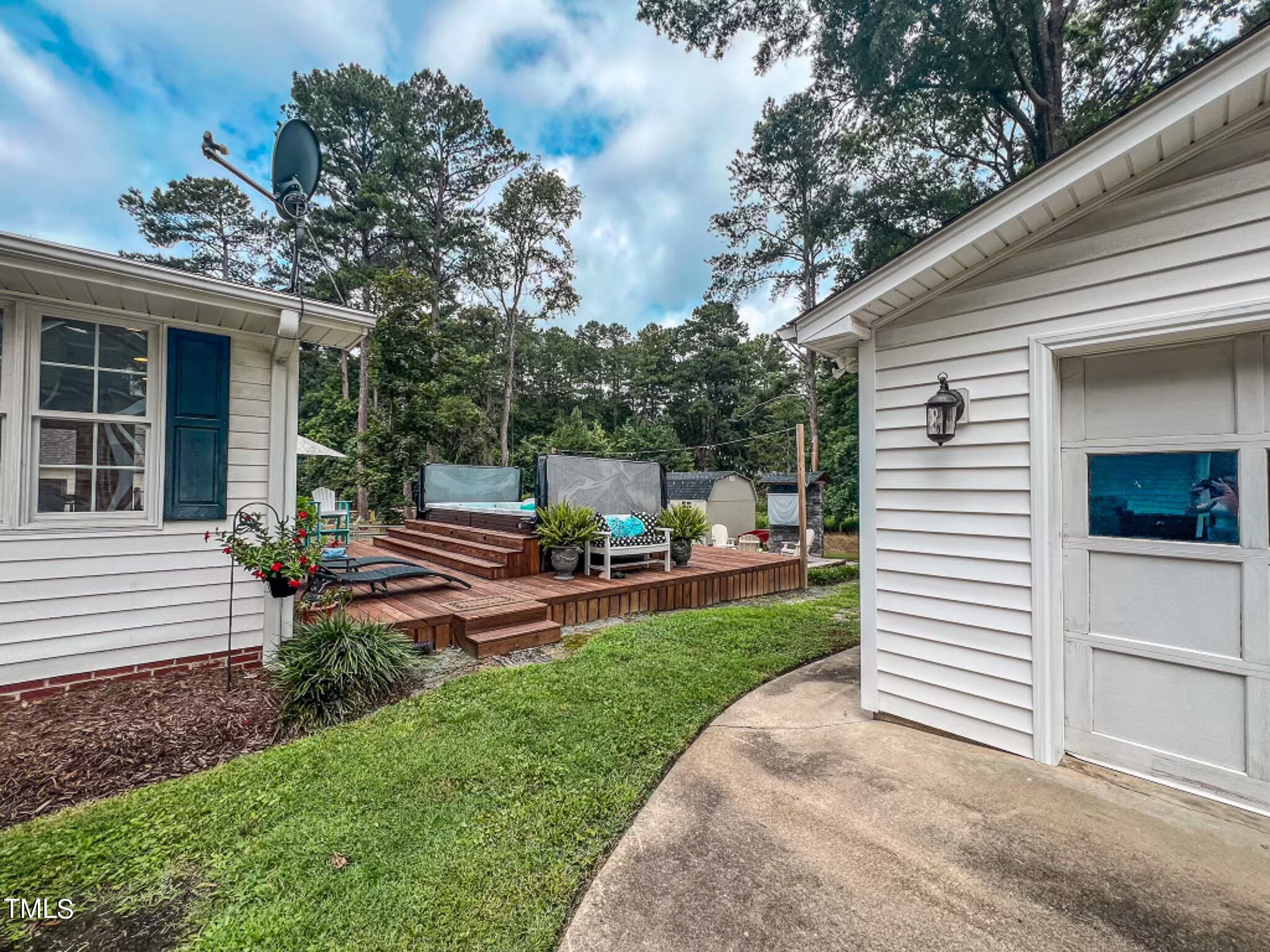 1804 Grady Drive Durham, NC 27712 - Photo 20 of 43 a view of a house with a backyard and a garden