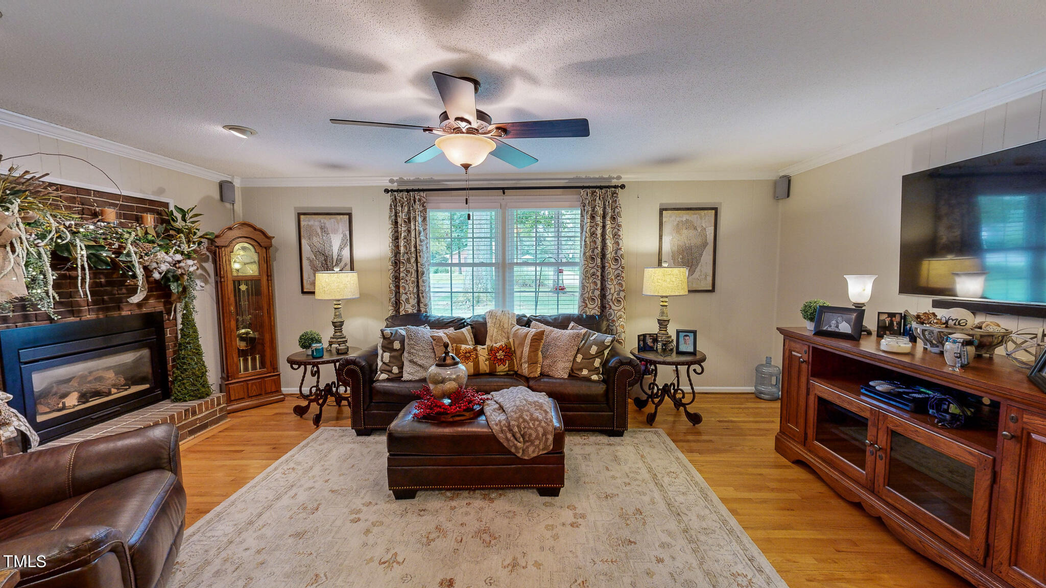 1804 Grady Drive Durham, NC 27712 - Photo 25 of 43 a living room with furniture fireplace and flat screen tv