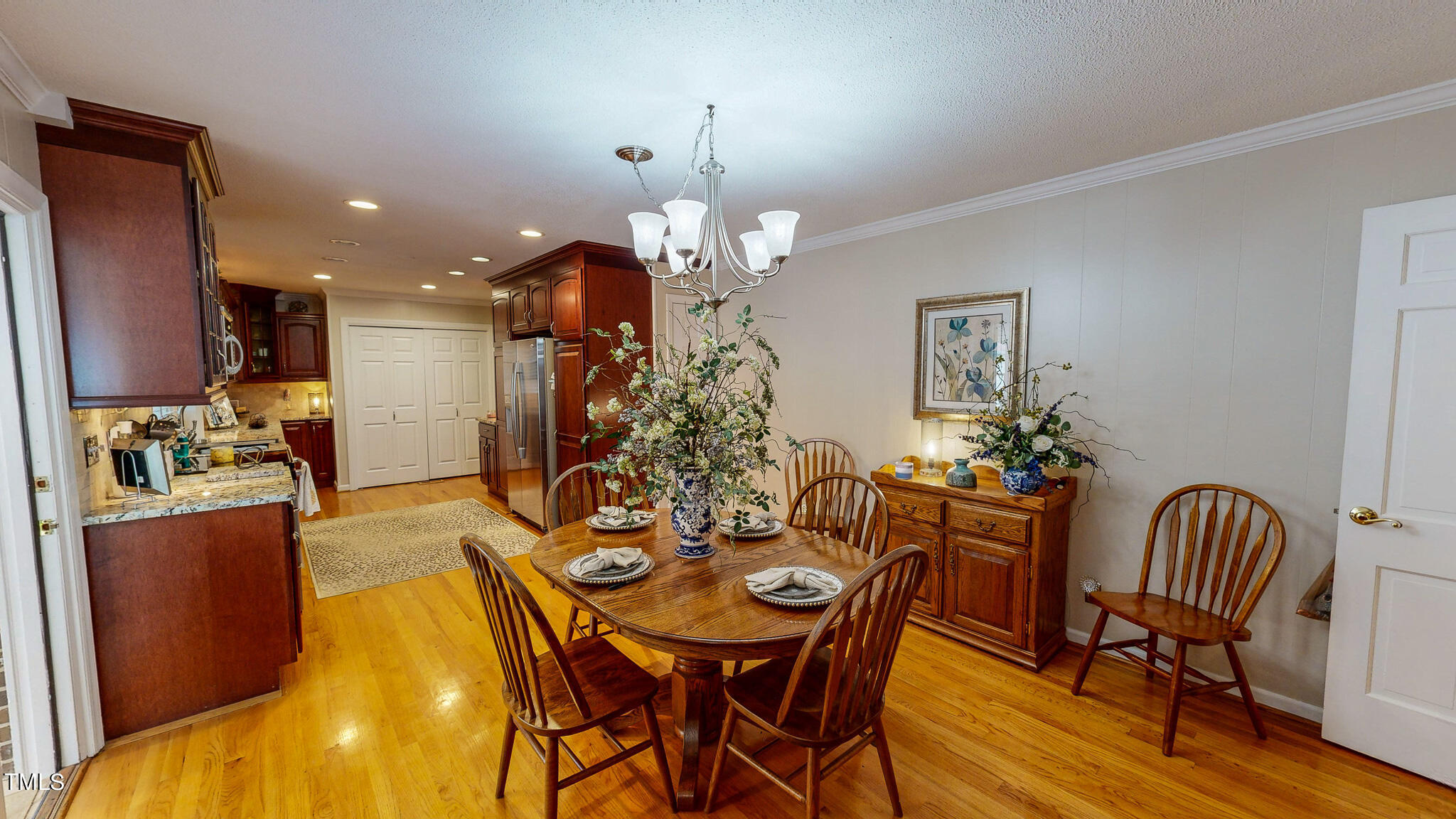 1804 Grady Drive Durham, NC 27712 - Photo 26 of 43 a view of a dining room with furniture and wooden floor
