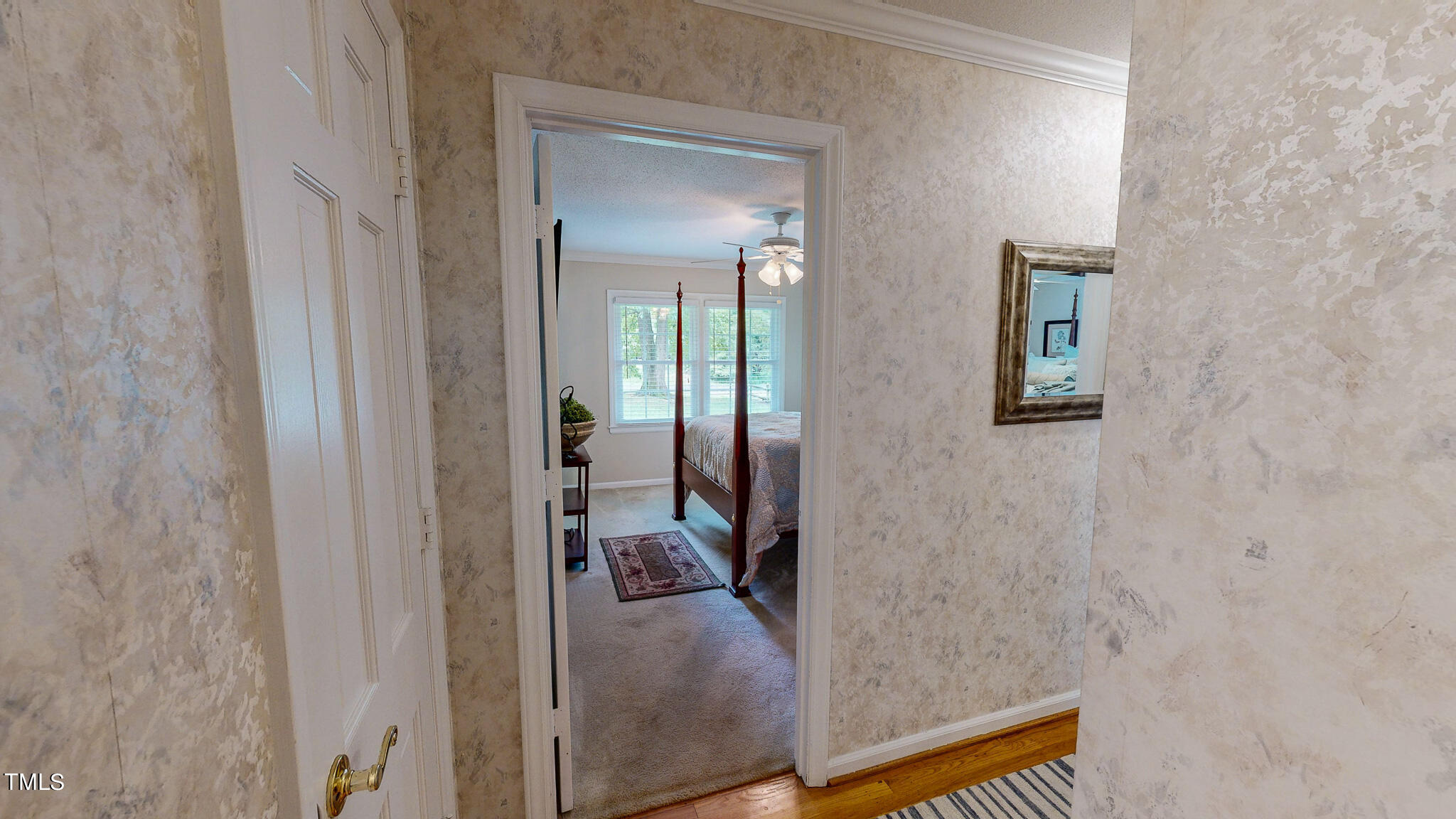 1804 Grady Drive Durham, NC 27712 - Photo 31 of 43 a view of a hallway with a livingroom and a bathroom with sink