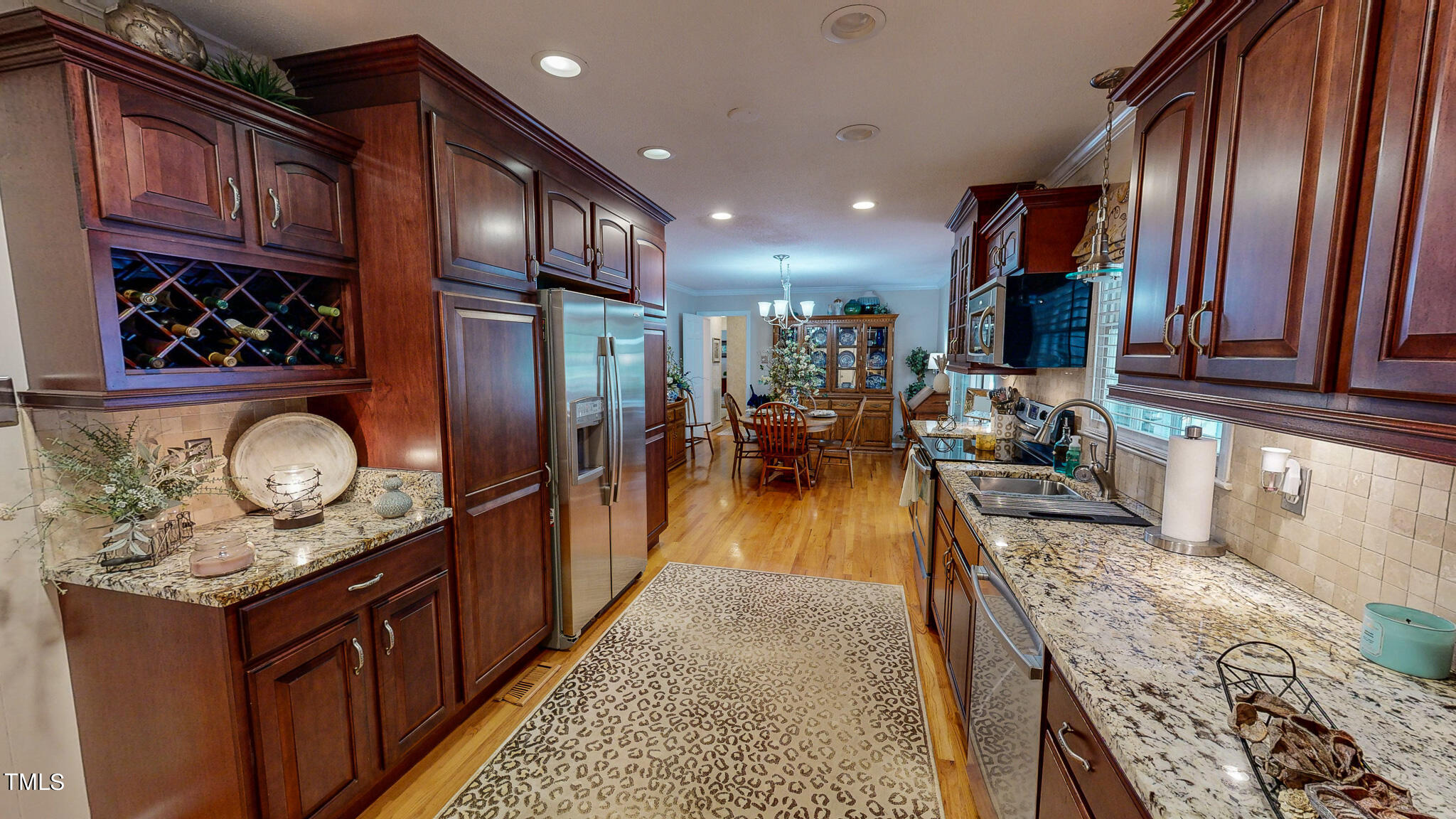 1804 Grady Drive Durham, NC 27712 - Photo 4 of 43 a kitchen with stainless steel appliances granite countertop a sink stove and refrigerator