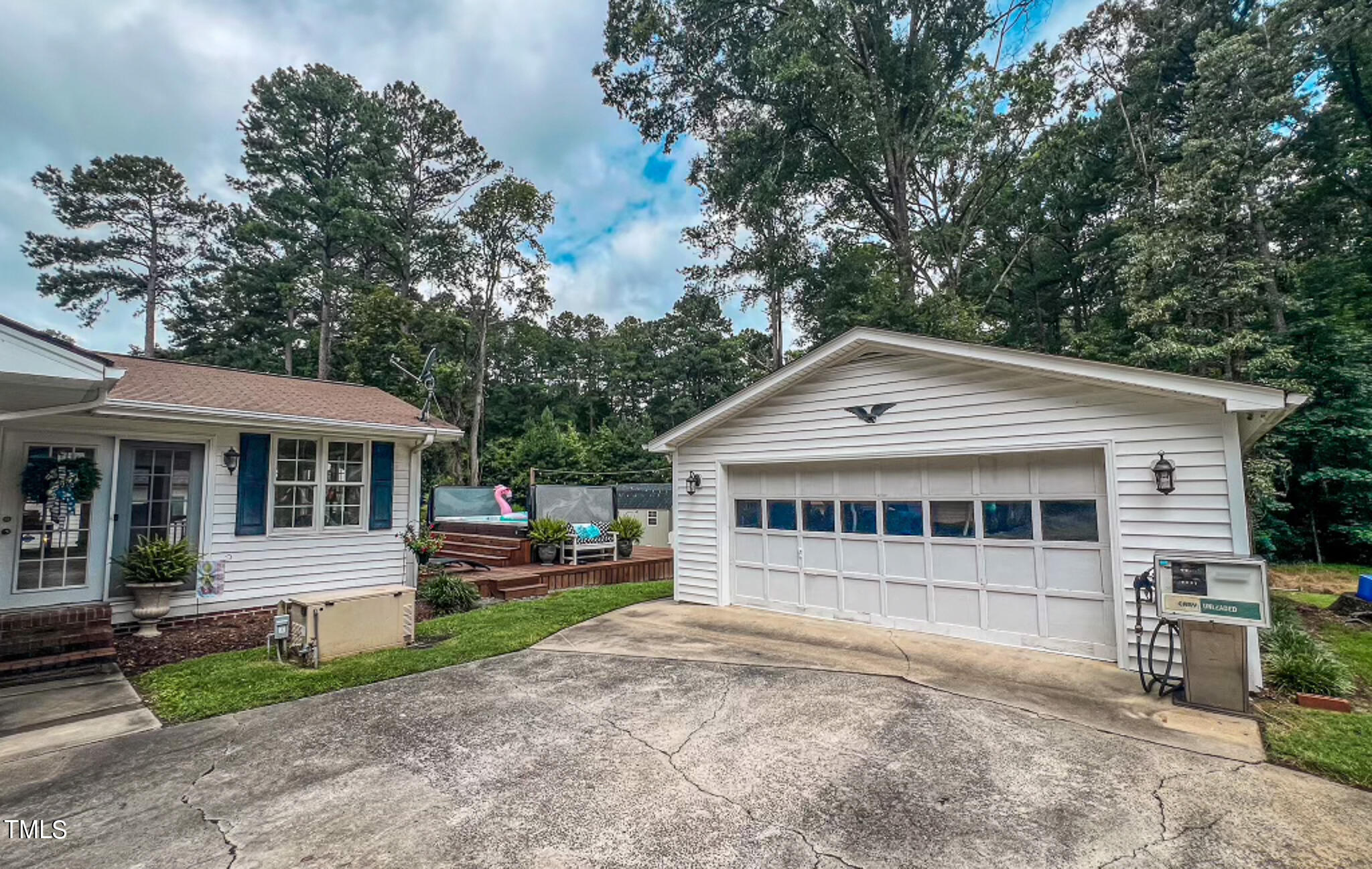 1804 Grady Drive Durham, NC 27712 - Photo 41 of 43 a view of a white house with a big yard and potted plants